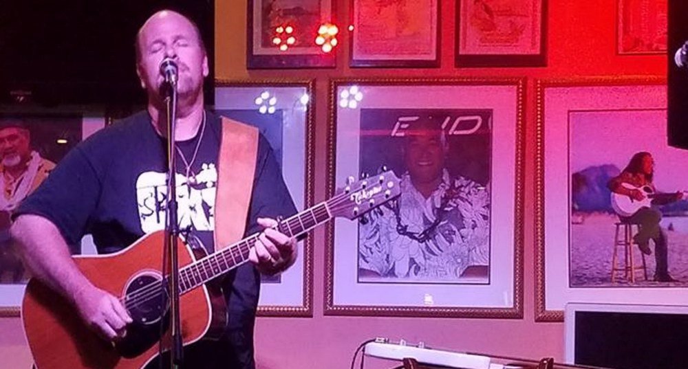 Jason Colannino singer and songwriter playing acoustic guitar